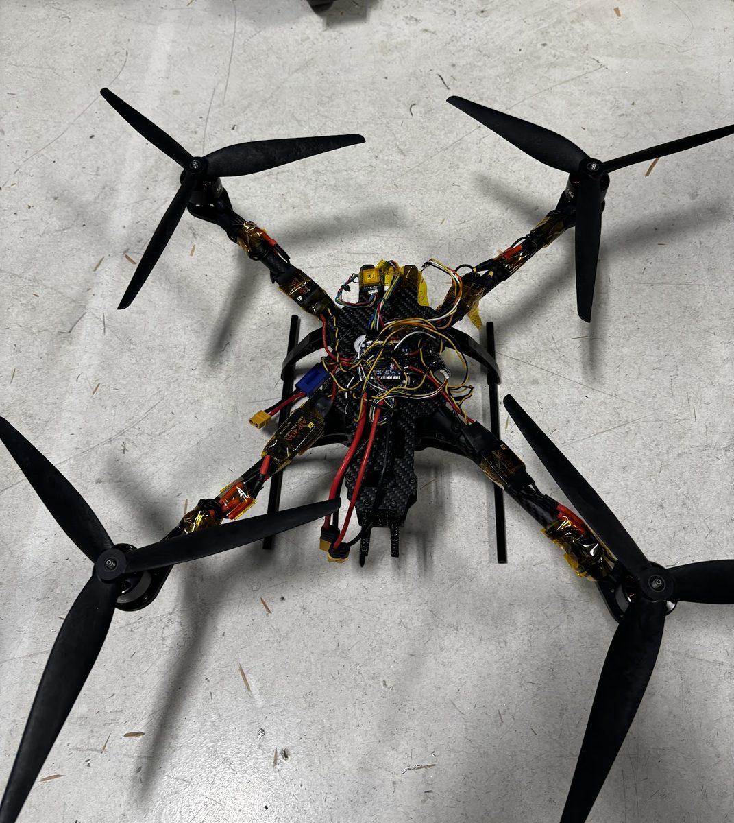 Custom hand-built autonomous quadcopter with a carbon-fiber frame and Pixhawk flight controller