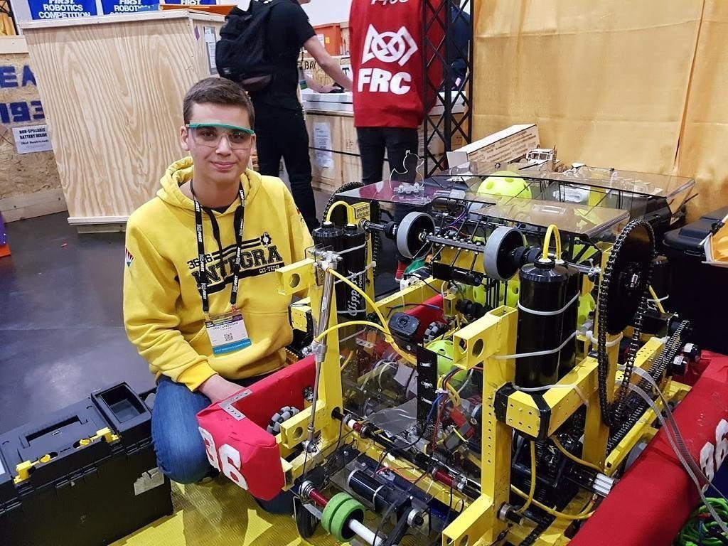 Onat Cakici with the Team Integra 3646 FRC competition robot at the FIRST World Championship