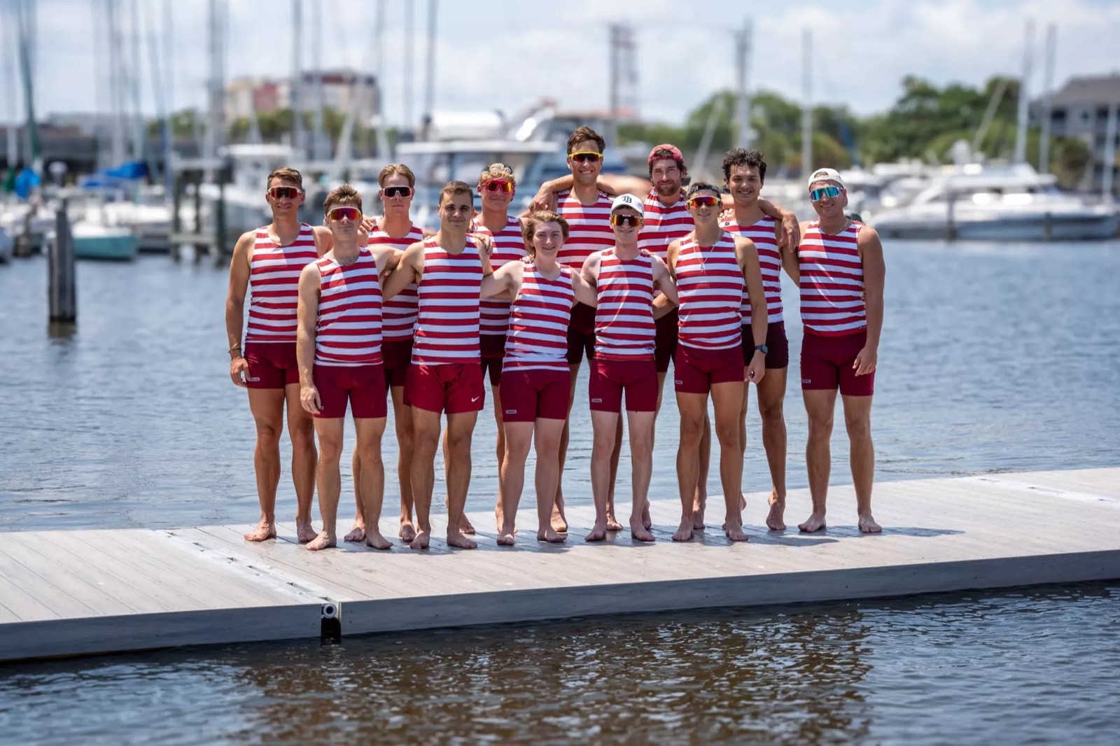 Onat Cakici with his college rowing crew on the dock